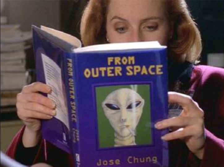 Agent Scully reading a book about Aliens